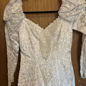 Elegant White Beaded Gown with Intricate Details